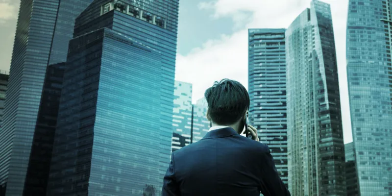 businessman-talking-phone-city